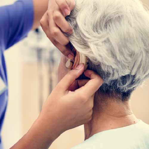 A person being fitted for a hearing aid